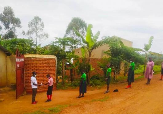Children standing outside school in a line